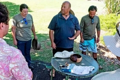 Ikaika Nakahashi leading a pule with team