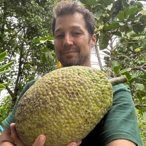 Noa holding a large ʻulu